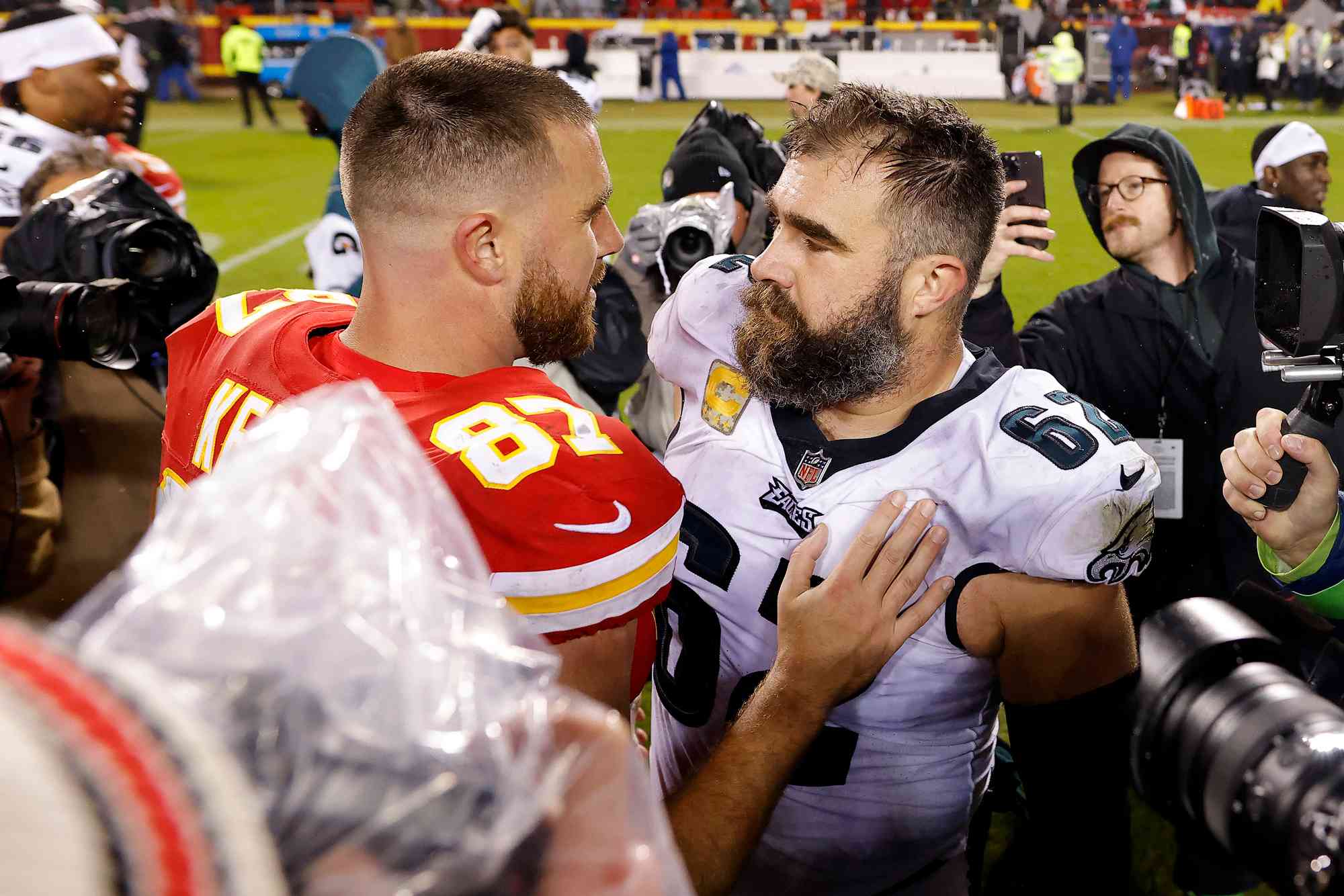 Jason Kelce #62 of the Philadelphia Eagles talks to brother Travis Kelce #87 of the Kansas City Chiefs