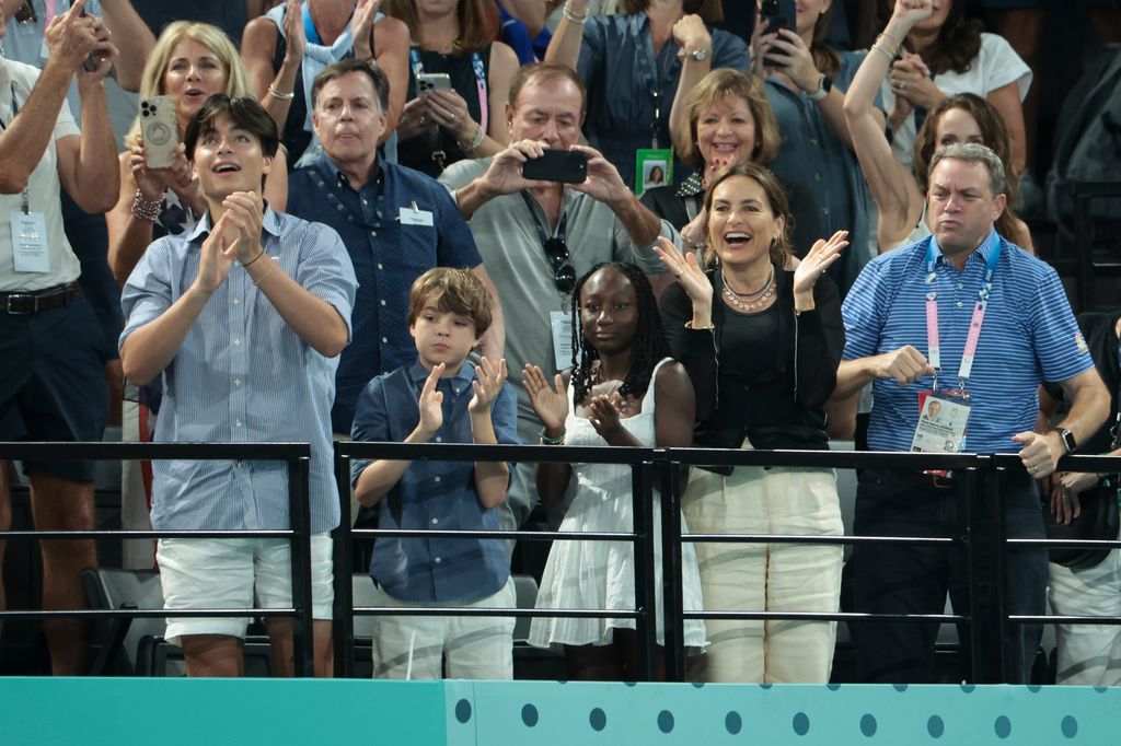 Mariska Hargitay with her sons August Hermann, Andrew Hermann and her daughter Amaya Hermann, right Mark Lazarus, above left Bob Costas celebrate the gold medal of Simone Biles and bronze medal of Sunisa Suni Lee of USA following the Artistic Gymnastics Women's All-Around Final on day six of the Olympic Games Paris 2024 at Bercy Arena on August 1, 2024 in Paris, France.