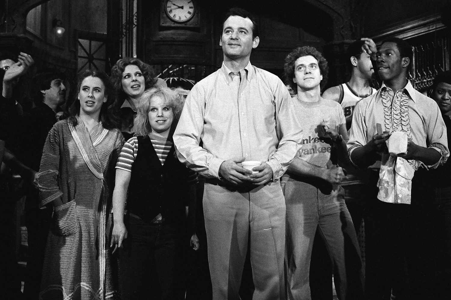 SATURDAY NIGHT LIVE -- Episode 12 -- Pictured: (l-r) Charles Rocket, Gail Matthius, Denny Dillon, Ann Risley, Bill Murray, Gilbert Gottfried, Joe Piscopo, Eddie Murphy during the 'Closing' on March 7, 1981 -- Photo by: NBC/NBCU Photo Bank