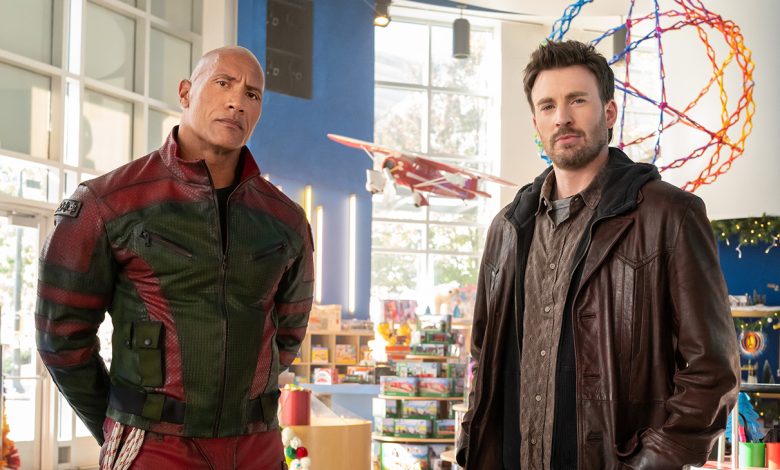 Dwayne Johnson and Chris Evans on the set of