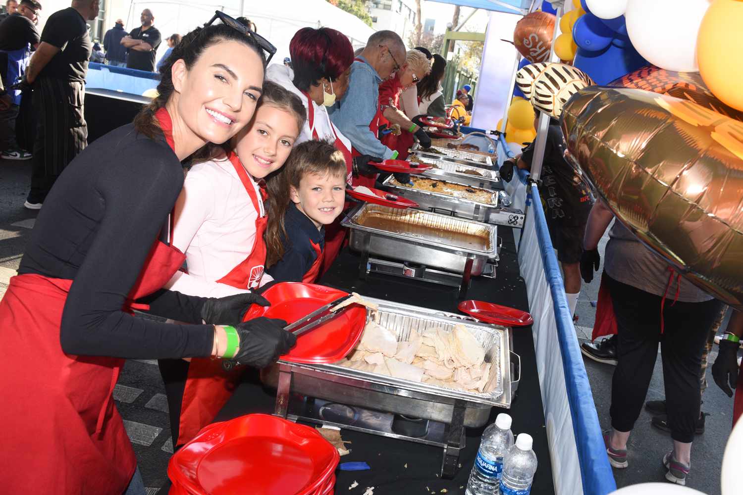 Elizabeth Chambers volunteers with her children Harper and Ford at the LA Mission