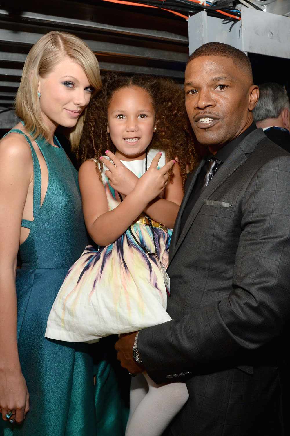 Taylor Swift, Annalise Bishop, and recording artist Jamie Foxx attend The 57th Annual GRAMMY Awards at STAPLES Center on February 8, 2015 in Los Angeles, California.