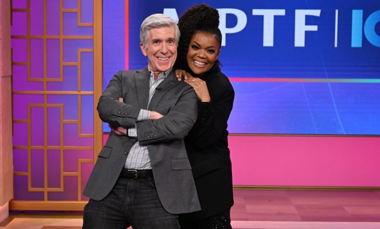 Tom Bergeron and Yvette Nicole Brown pose at a telethon at KTLA 5.