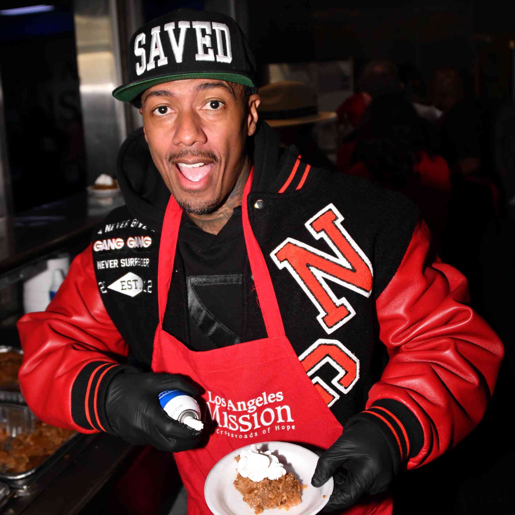 Nick Cannon seen as he hands out Christmas dinner to the homeless on skid row on December 20, 2024 at the Los Angeles Mission in Los Angeles, California