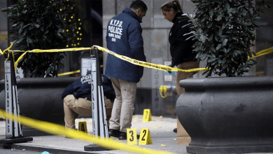 Police place bullet casing markers outside of a Hilton Hotel in Midtown Manhattan where United Healthcare CEO Brian Thompson was fatally shot on Dec. 4, 2024, in New York City.