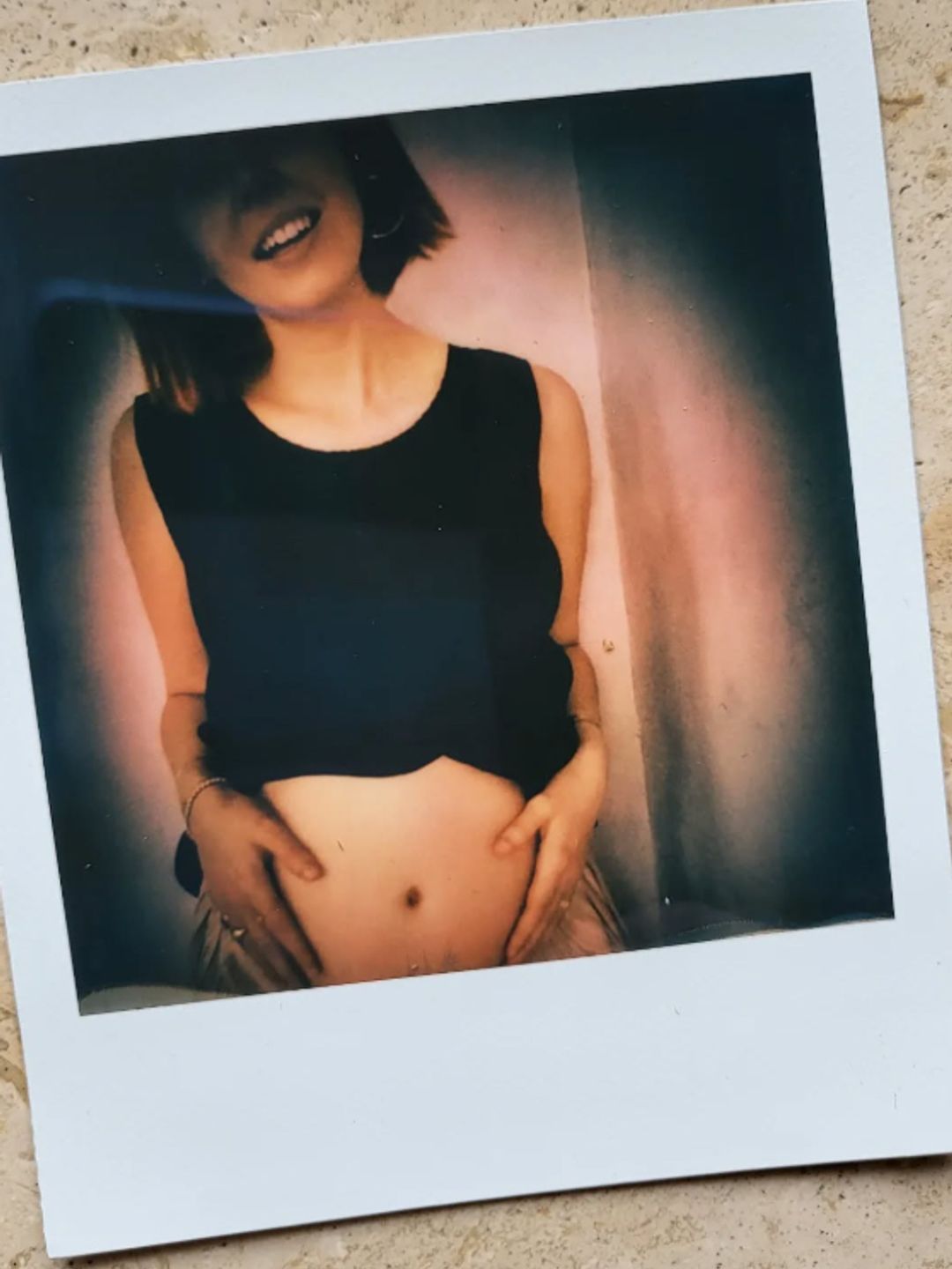 A pregnant Stacey Dooley in a polaroid picture