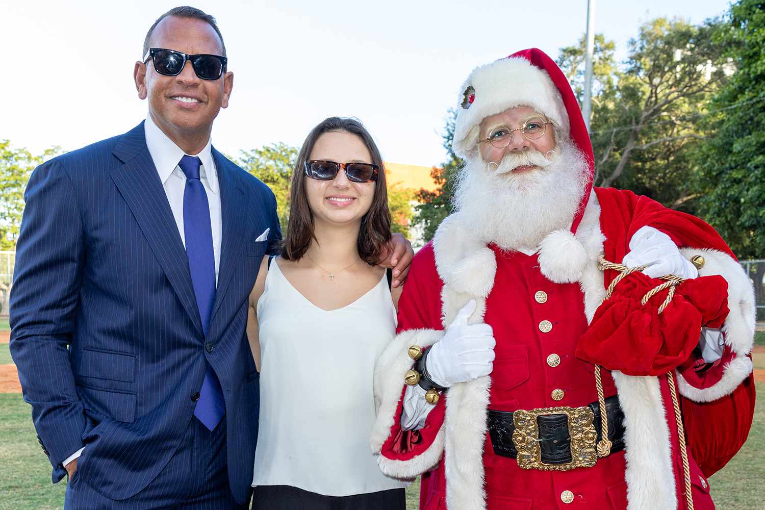 Alex Rodriguez, Natasha Rodriguez and Santa Claus are seen during A-Rod Corp's 17th annual toy drive benefiting Boys & Girls Clubs of Miami-Dade