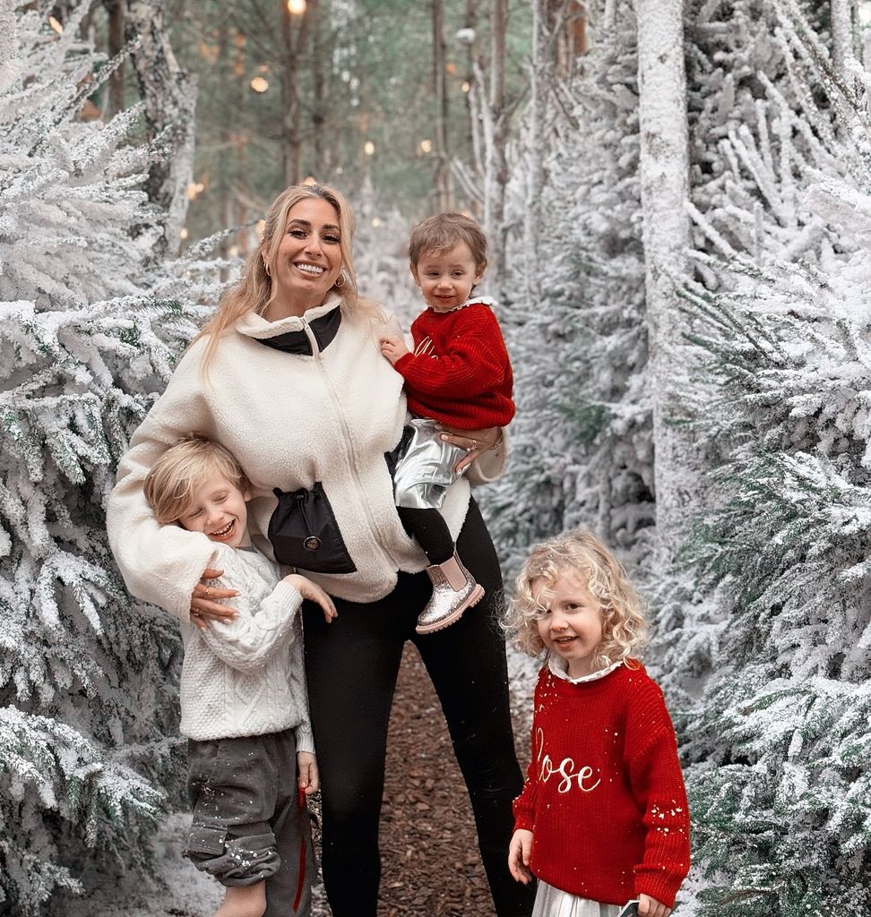 stacey with her three kids in snowy forest