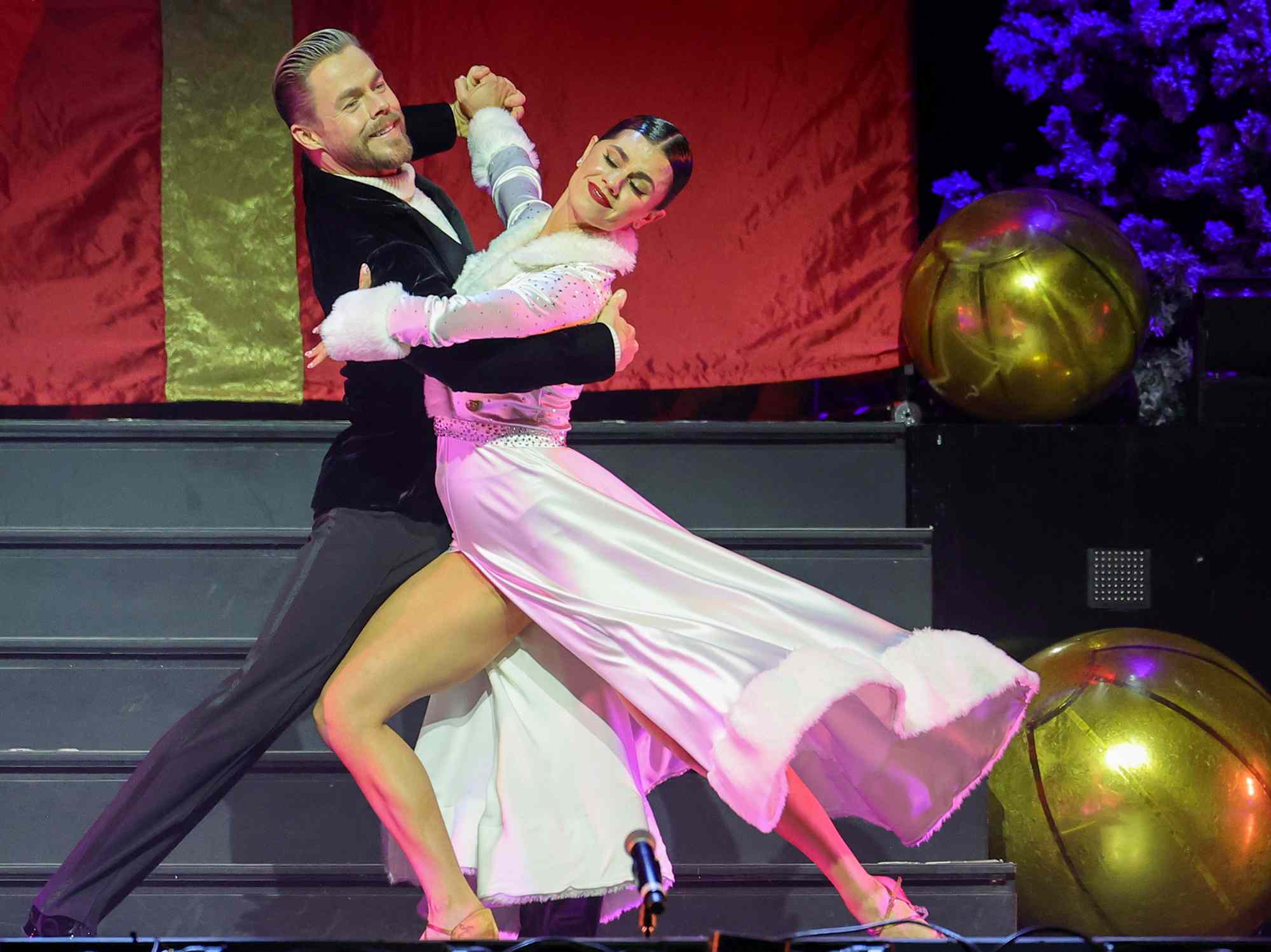 Derek Hough (L) and Hayley Erbert Hough perform during a stop of Derek Hough's Dance for the Holidays tour at BleauLive Theater at Fontainebleau Las Vegas on December 20, 2024 in Las Vegas, Nevada.