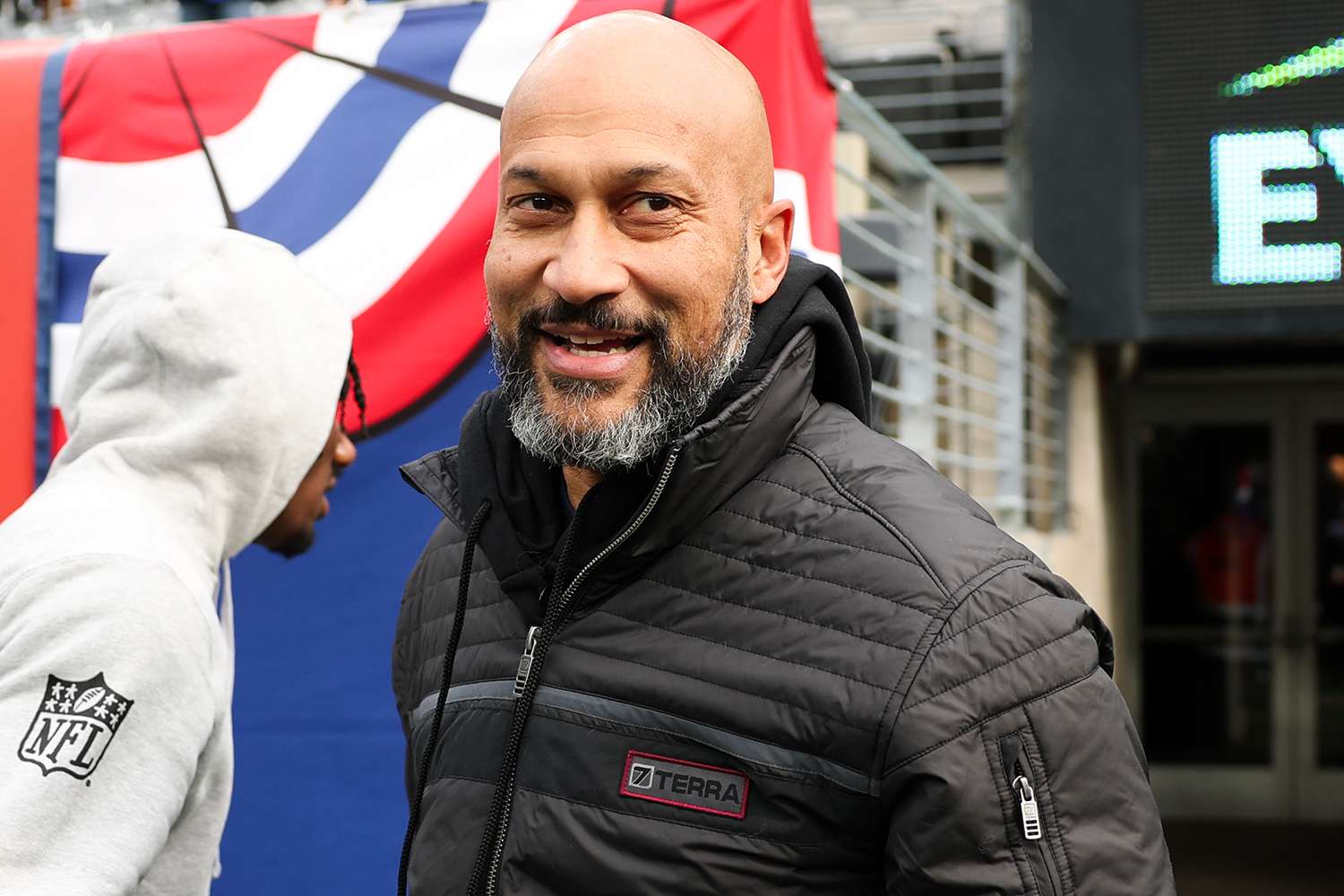 Malik Nabers #1 of the New York Giants meets with actor Keegan Michael Key prior to the start of the game against the Baltimore Ravens