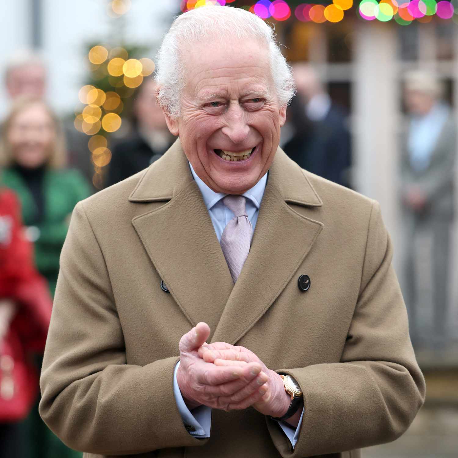 King Charles III smiles as he arrives for the The King's Foundation's annual 'Crafts at Christmas' at 