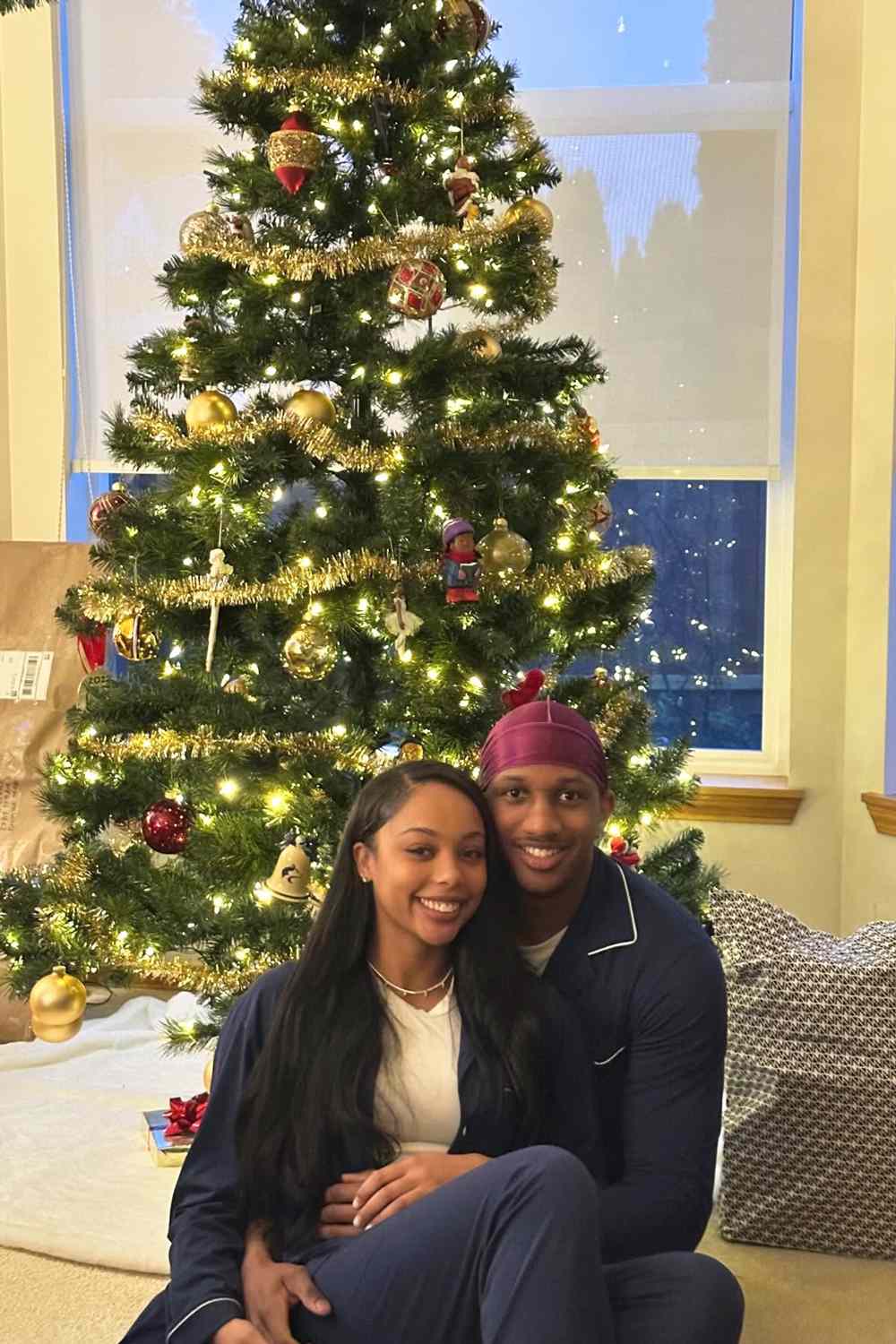 Michael Penix Jr. and his girlfriend Olivia Carter celebrate Christmas together in December 2023.