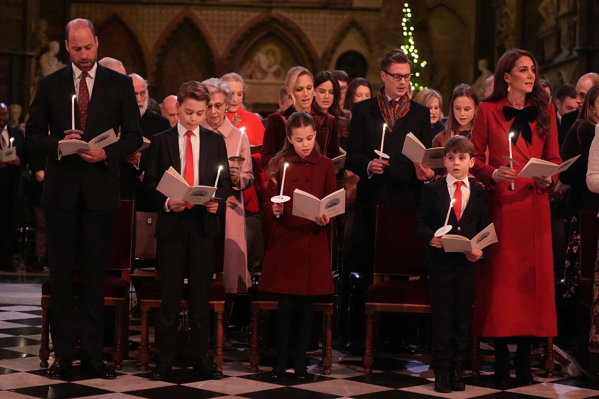 Prince William, Prince of Wales, Prince George, Princess Charlotte, Prince Louis and Catherine, Princess of Wales during the 'Together At Christmas' Carol Service at Westminster Abbey on December 6, 2024 in London, England.