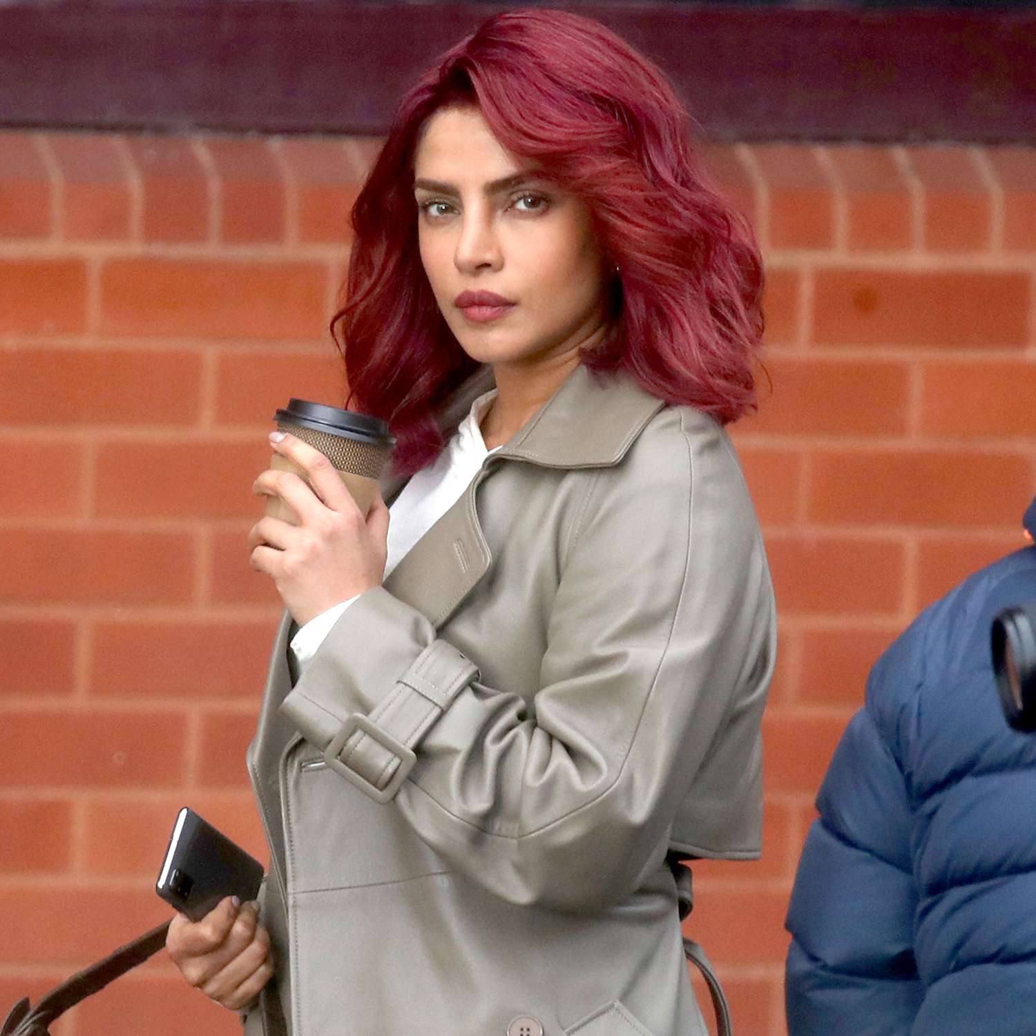 Priyanka Chopra swaps her dark hair for a striking red look on the set of Prime's Citadel as she filmed scenes for the second 