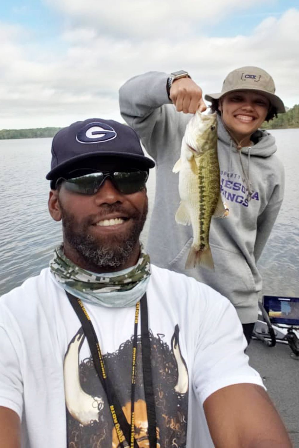 Randy Moss and his daughter Sydney Moss fishing together.