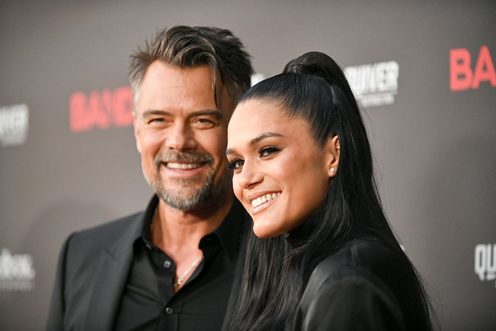 Josh Duhamel and Audra Mari pose in black outfits at the world premiere of Bandit