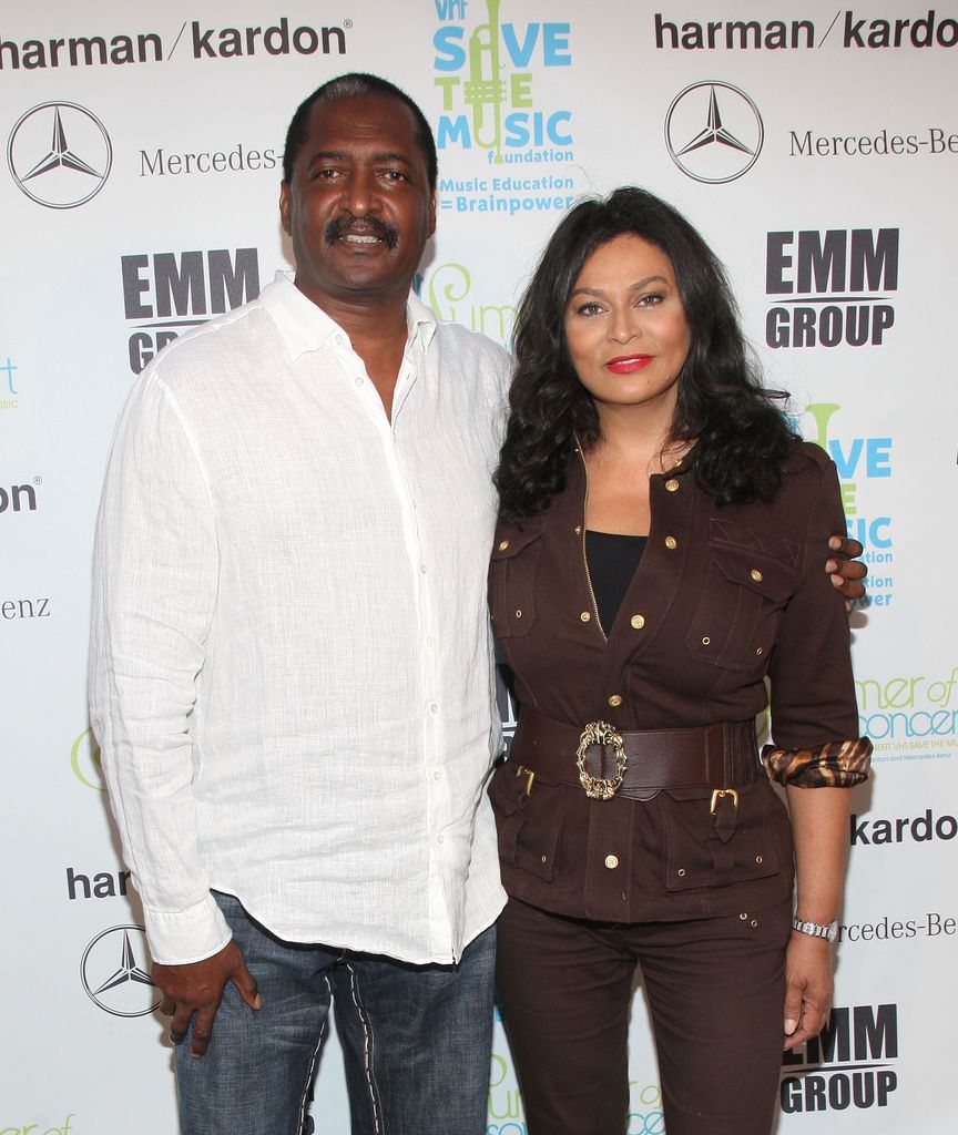 Tina Knowles and Mathew Knowles smiling on the red carpet