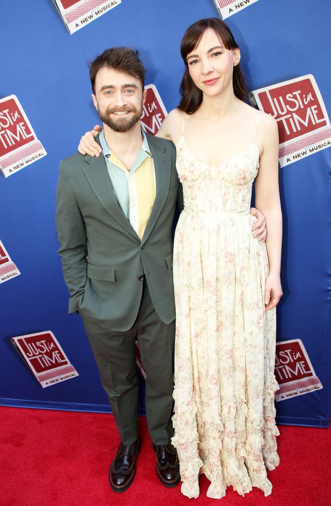 photo of daniel radcliffe and partner erin drake with arms around each other