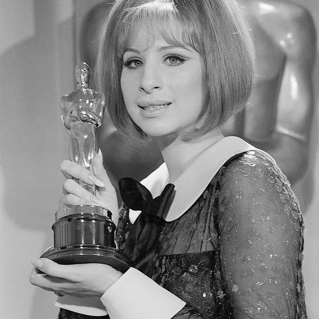 (Original Caption) 4/14/69-Los Angeles, CA- Barbra Streisand holds her "Oscar" after she was named co-winner of the Best Actress Award in the 41st Annual Academy Awards. Streisand and Katharine Hepburn made Academy history with the dual award.