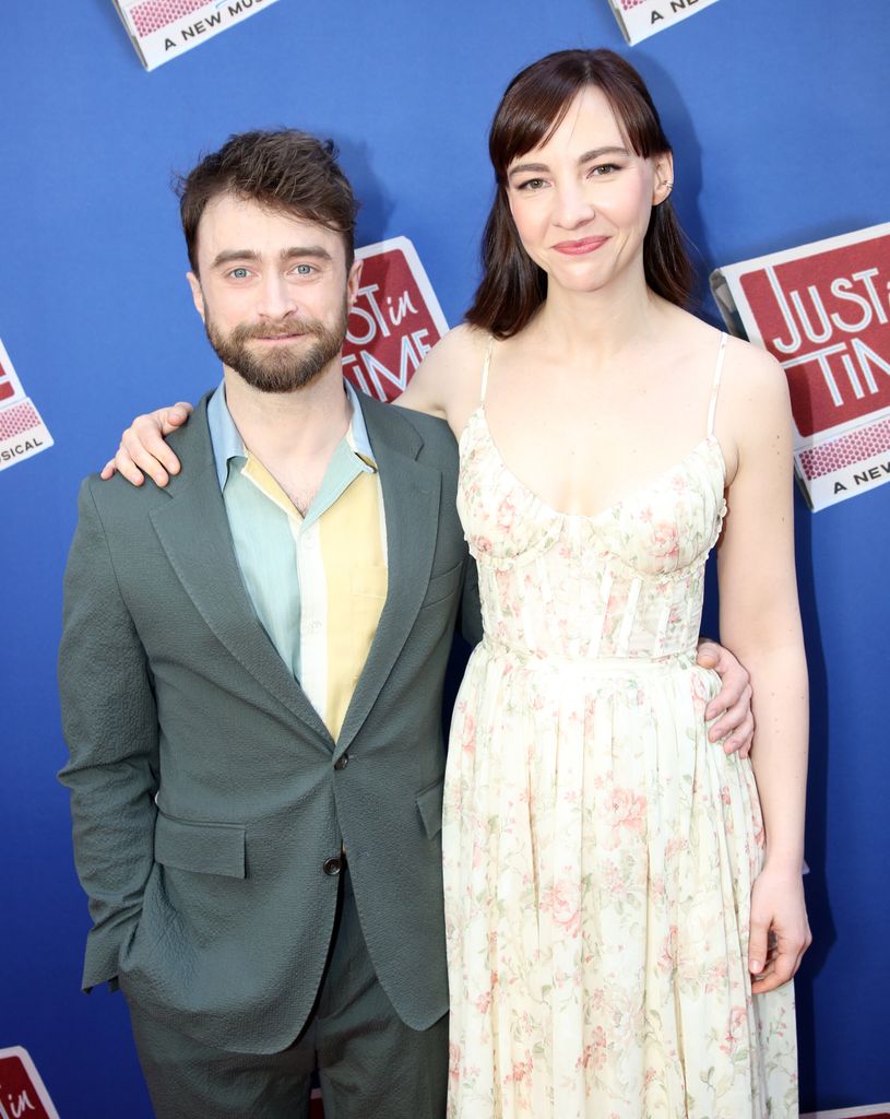photo of daniel radcliffe and partner erin drake with arms around each other