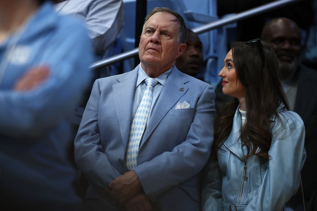 Bill Belichick and his girlfriend Jordon Hudson look on during the first half of the game between the North Carolina Tar Heels and the Duke Blue Devils at Dean E. Smith Center on March 08, 2025 in Chapel Hill, North Carolina