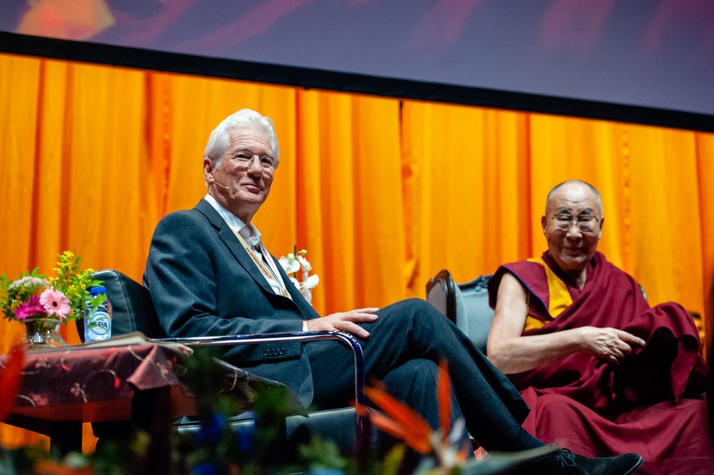 Richard Gere speaking with the Dalai Lama