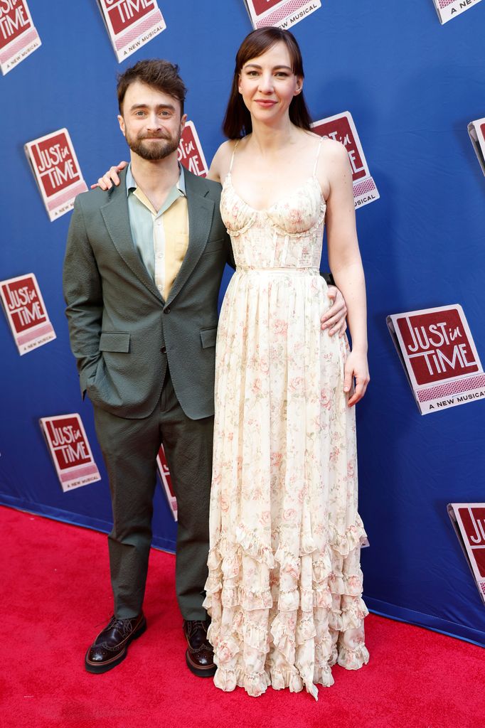 photo of daniel radcliffe and partner erin drake with arms around each other
