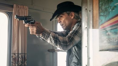 Zahn McClarnon as Joe Leaphorn points a gun on a train in the Dark Winds season three finale.