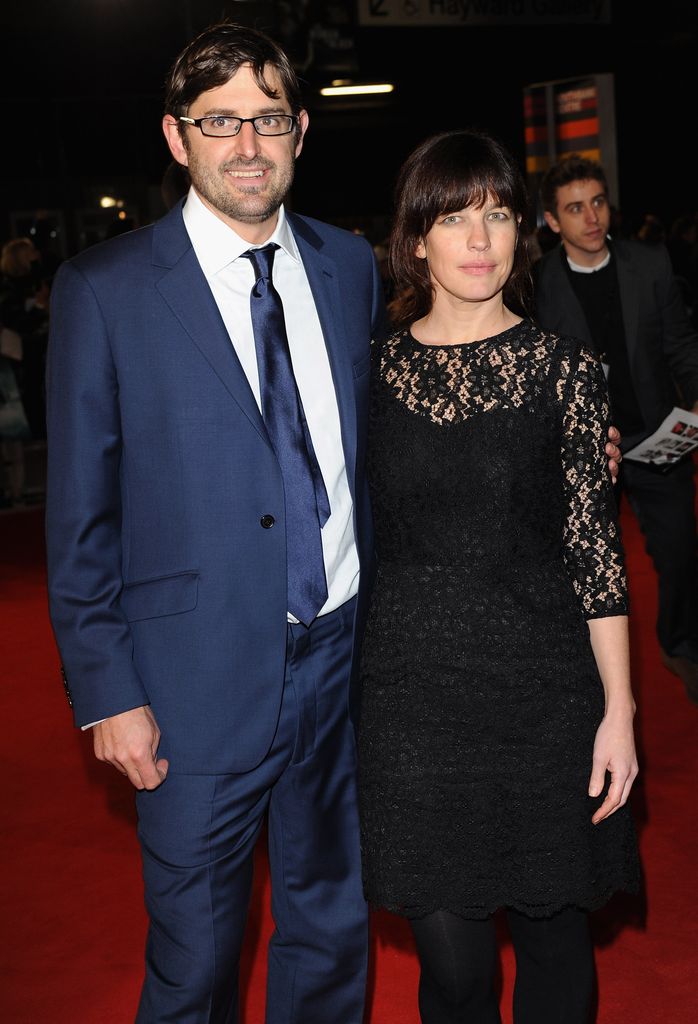 Louis Theroux in a blue suit with Nancy Strang in a black dress