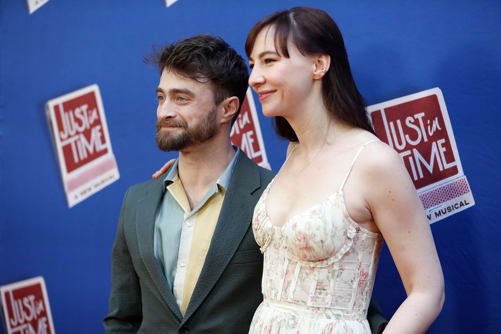 photo of daniel radcliffe and partner erin drake with arms around each other