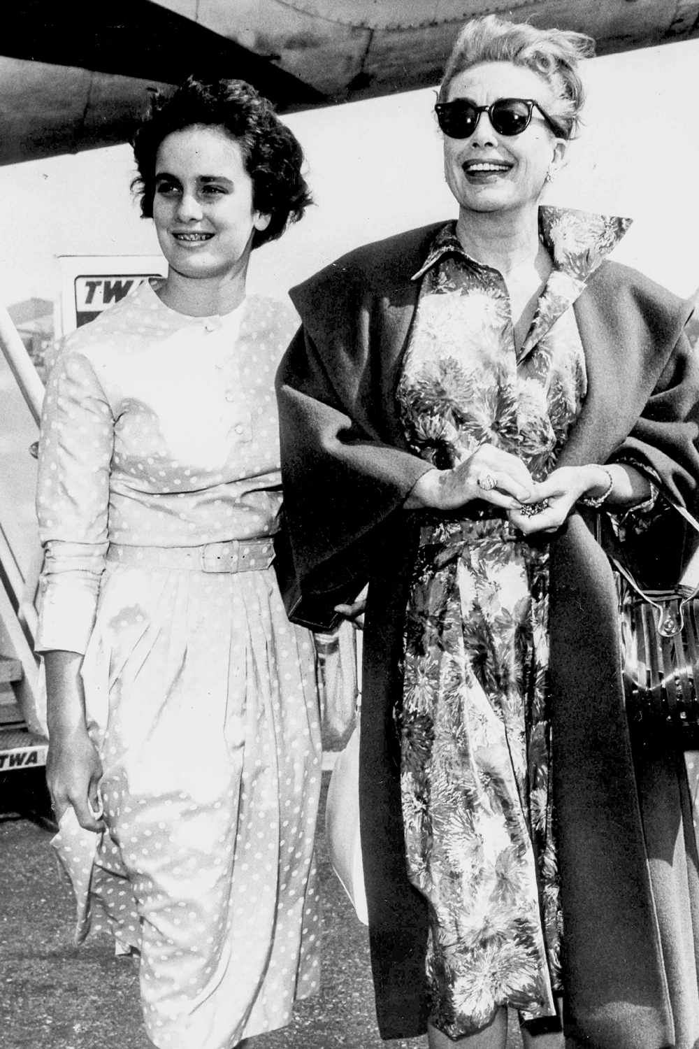 Joan Crawford with her daughter Cathy at Idlewild Airport in 1960 in New York.