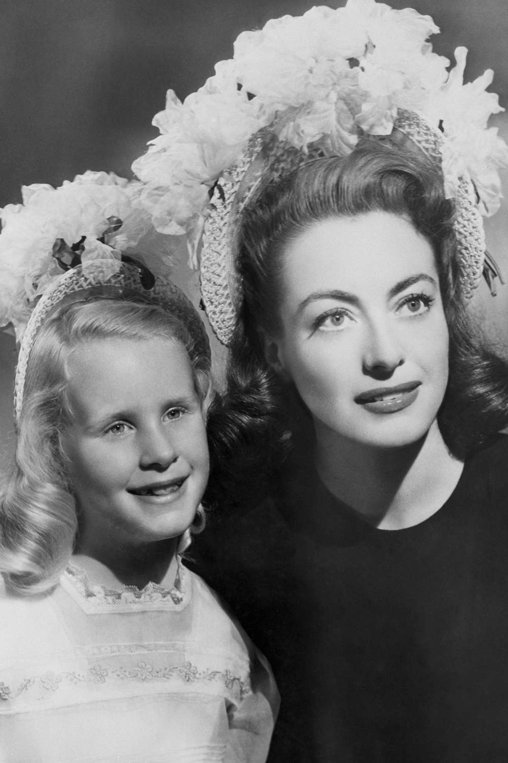 Joan Crawford and daughter Christina pose for a portrait together on April 18, 1946 in Hollywood, California.