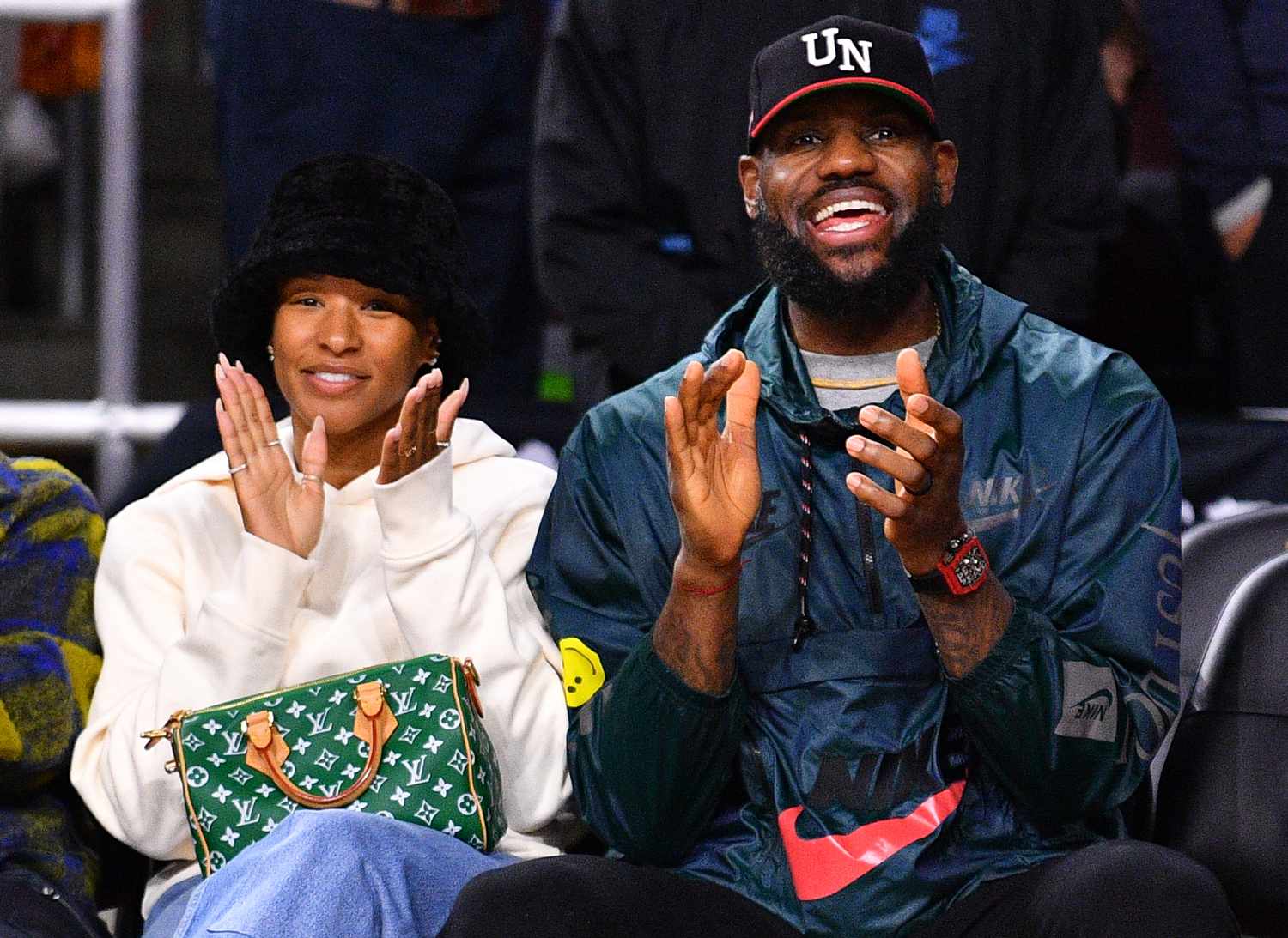 Lebron and Savannah James look on before the college basketball game between the Washington State Cougars and the USC Trojans on January 10, 2024 at Galen Center in Los Angeles, CA