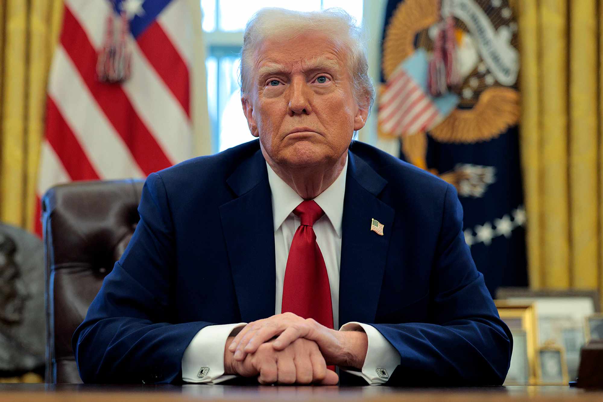 U.S. President Donald Trump talks to reporters in the Oval Office at the White House on January 30, 2025 in Washington, DC.