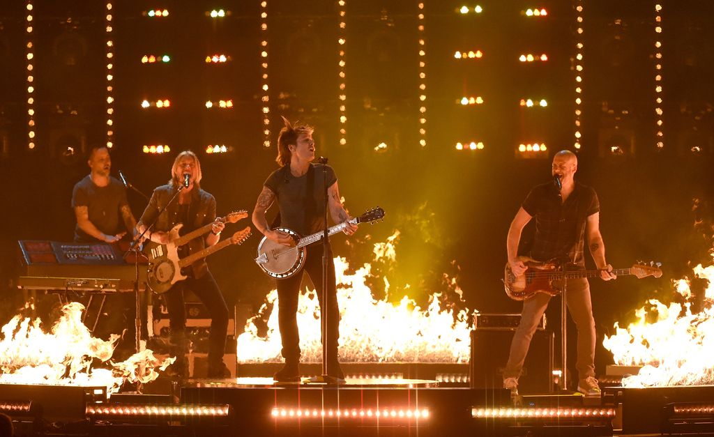 Keyboardist Nathan Barlowe, guitarist Danny Rader, recording artist Keith Urban and bassist Jerry Flowers perform during the 51st Academy of Country Music Awards at MGM Grand Garden Arena on April 3, 2016 in Las Vegas, Nevada.