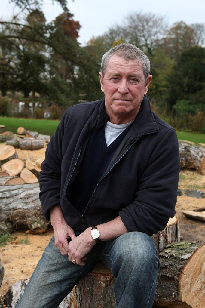 Man sitting on wooden log