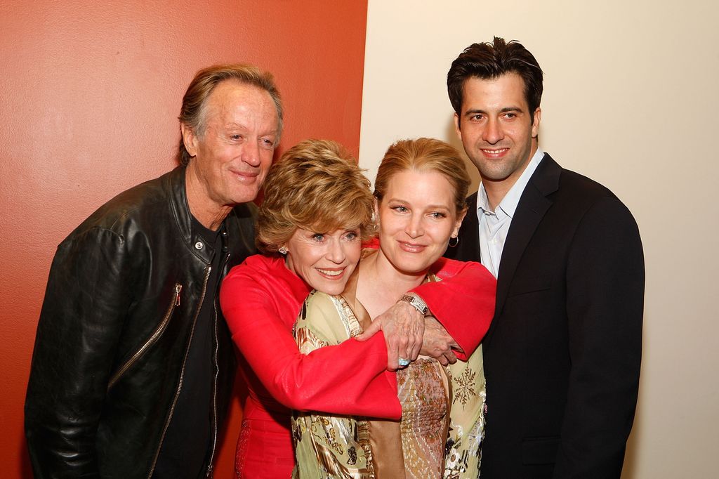 Peter Fonda, Jane Fonda, Bridget Fonda and Troy Garity pose for a family portrait