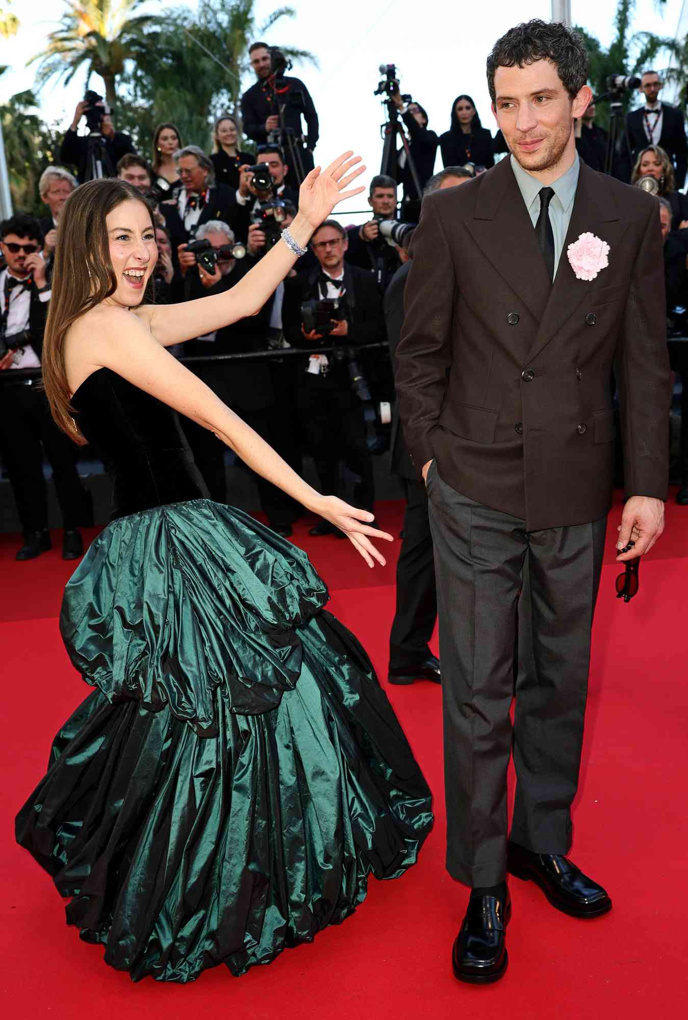 Alana Haim and Josh O'Connor attend the "The Mastermind" red carpet at the 78th annual Cannes Film Festival at Palais des Festivals on May 23, 2025 in Cannes, France.