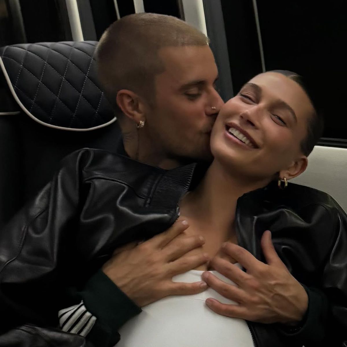 Hailey Baldwin embraced by Justin Bieber, smiling