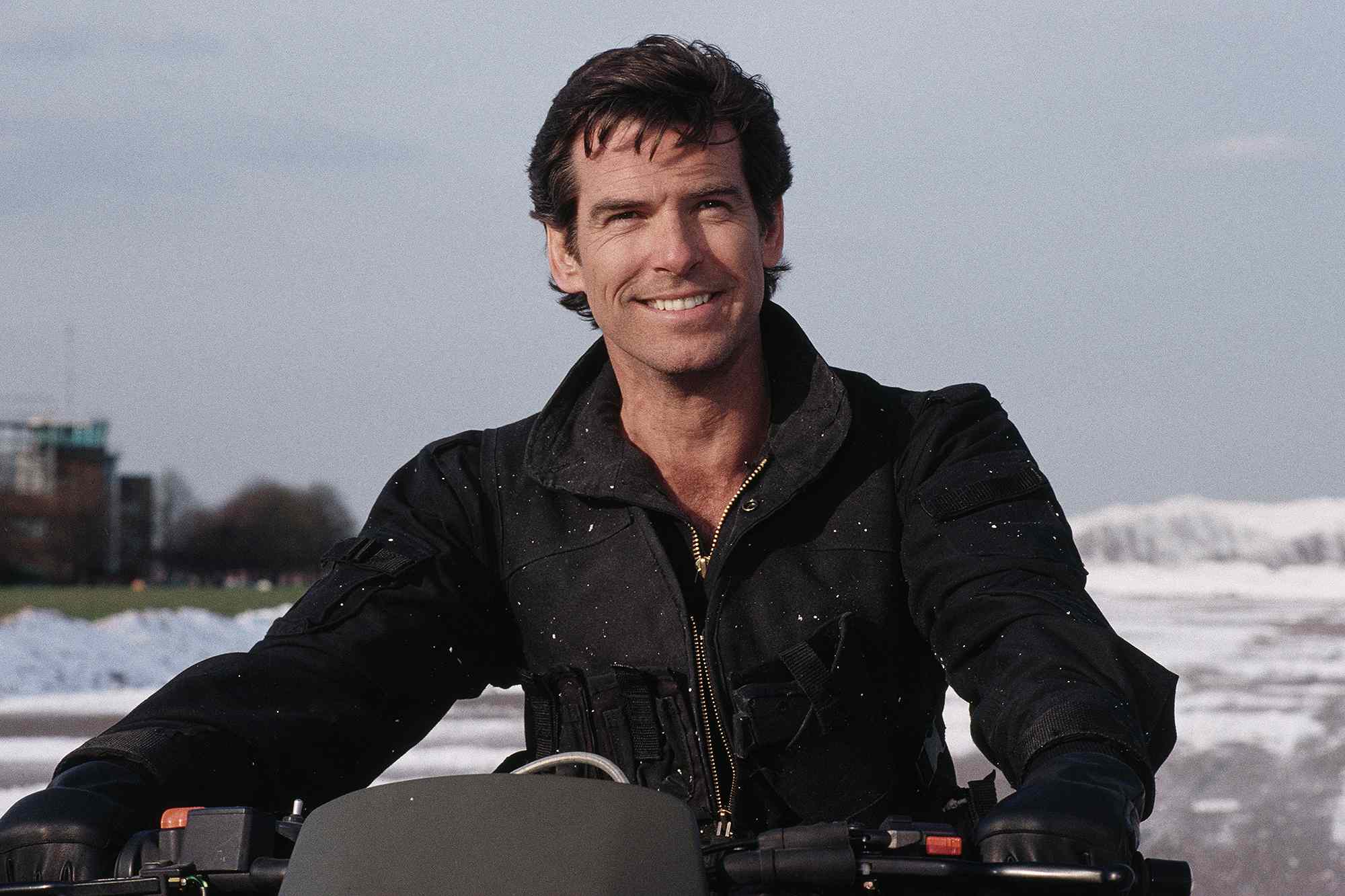Irish actor Pierce Brosnan as 007, driving a Cagiva motorcycle for the opening scene of the James Bond film 'GoldenEye', 1995.