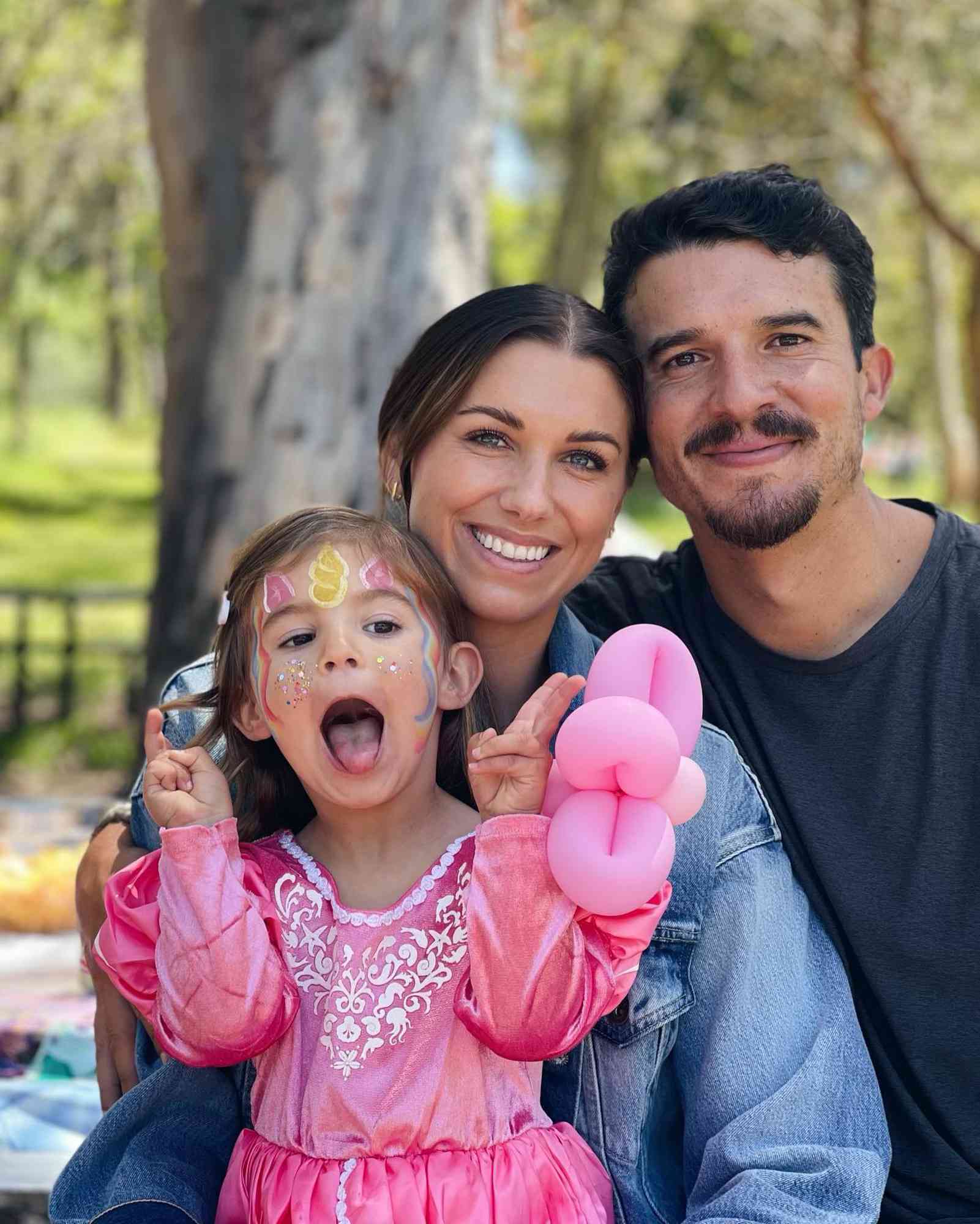Alex Morgan and Servando Carrasco with their daughter, Charlie