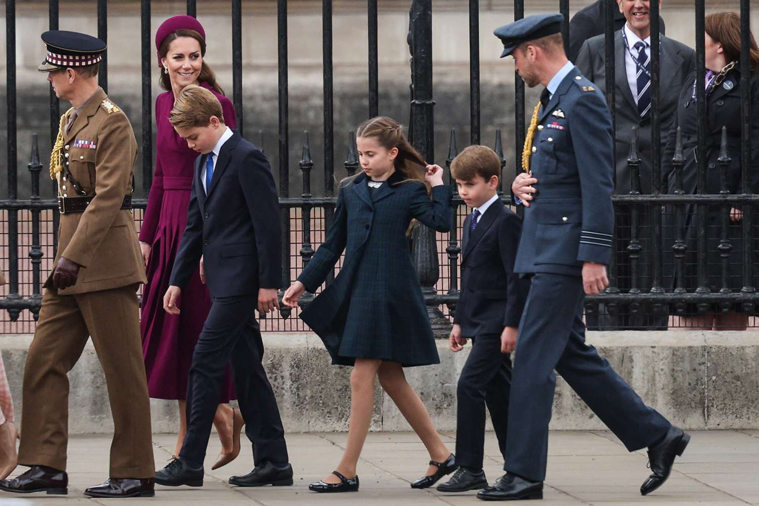 Britain's Catherine, Princess of Wales (C), Britain's Prince George of Wales (4R), Britain's Princess Charlotte of Wales (3R), Britain's Prince Louis of Wales (2R) and Britain's Prince William, Prince of Wales (R) arrive ahead of the armed forces procession to celebrate the 80th anniversary of VE Day