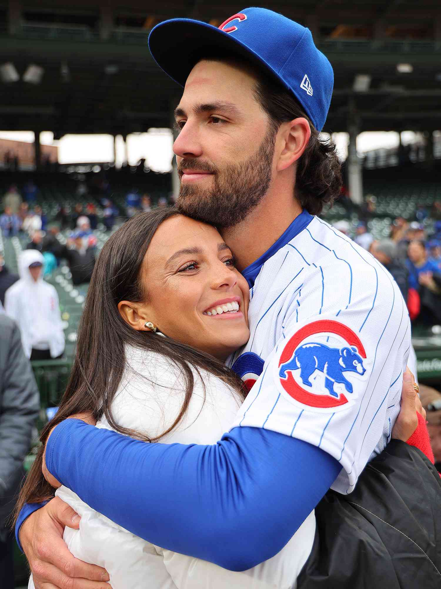Dansby Swanson #7 of the Chicago Cubs celebrates with his wife, Mallory Swanson