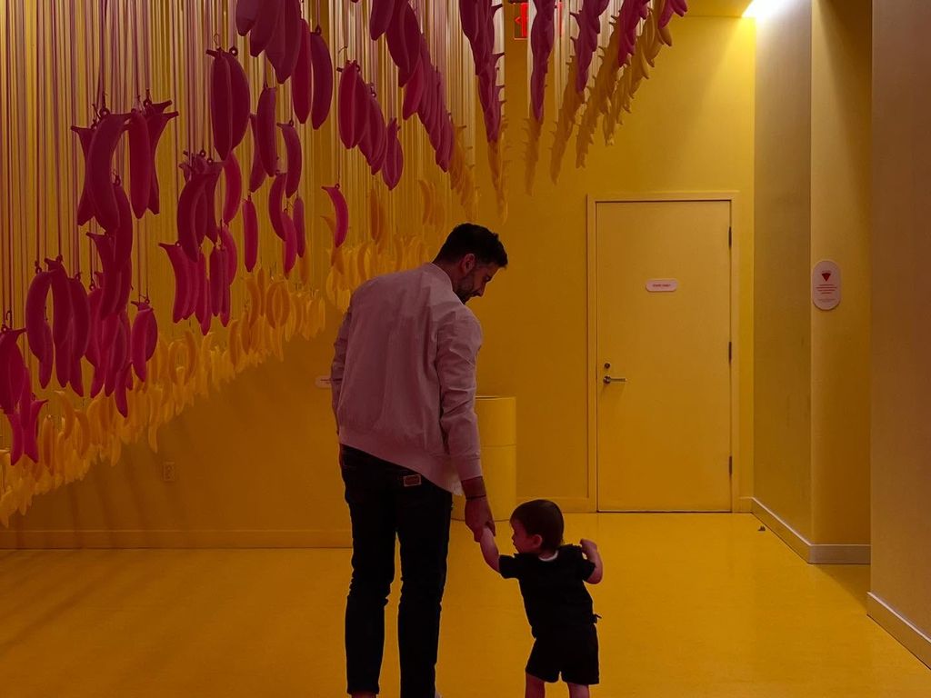 lindsay lohan husband holding sons hand