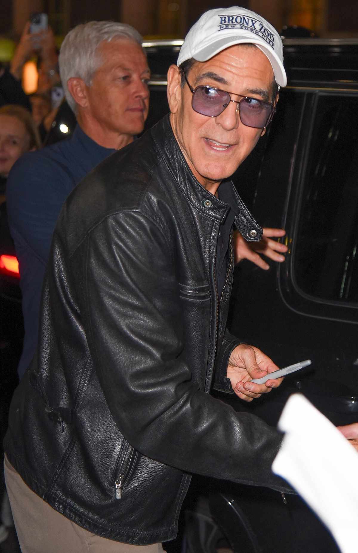 George Clooney greets his fans on his 64th birthday as he departs his Broadway show "Good Night, and Good Luck"