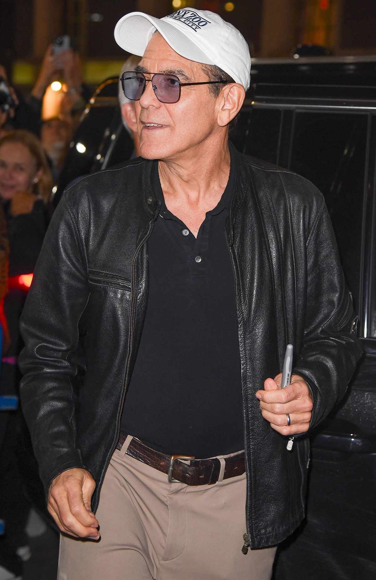 George Clooney greets his fans on his 64th birthday as he departs his Broadway show "Good Night, and Good Luck"