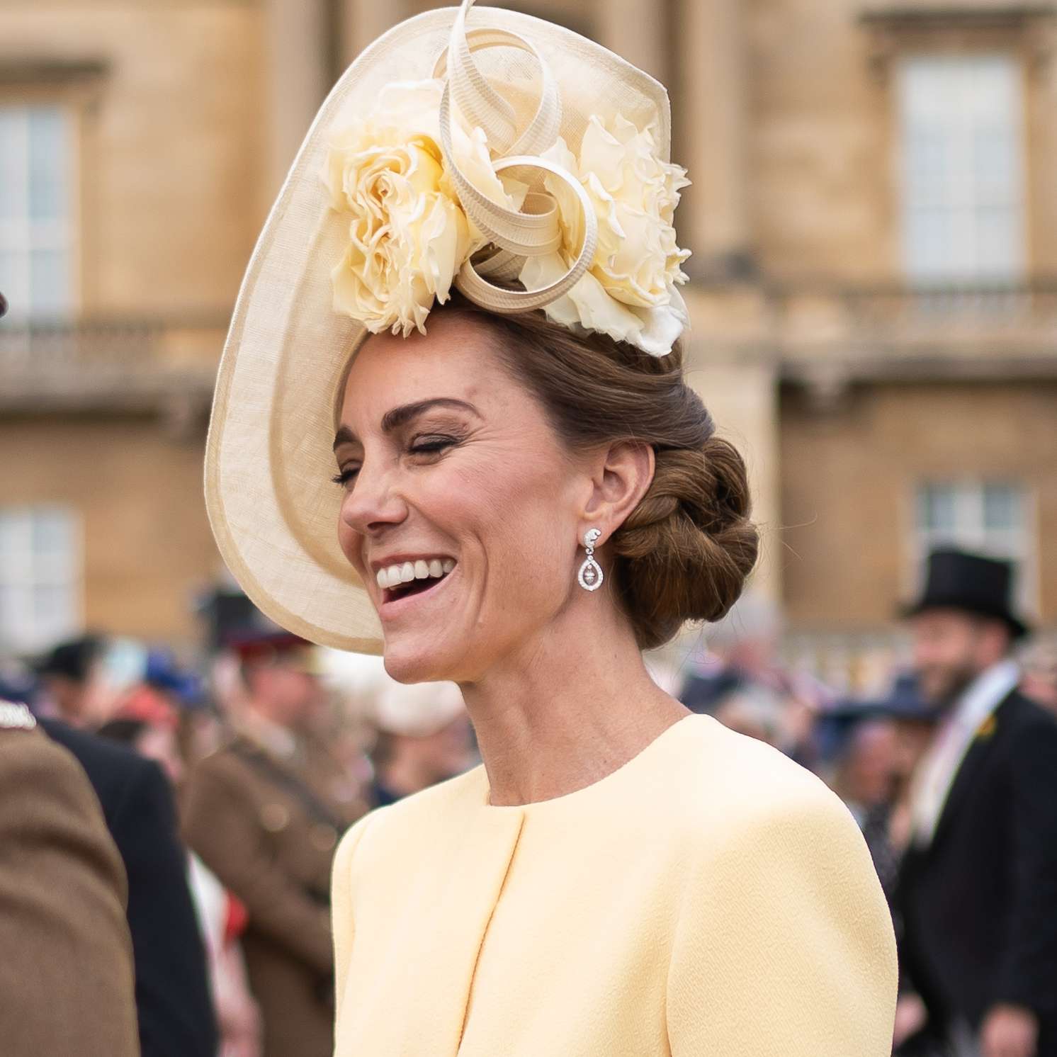 Catherine, Princess of Wales speaks to guests during a Royal Garden Party at Buckingham Palace on May 20, 2025 