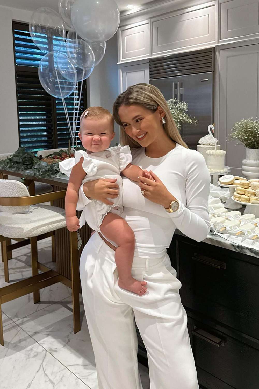 Molly-Mae Hague smiles with her daughter Bambi on her first birthday in January 2024.