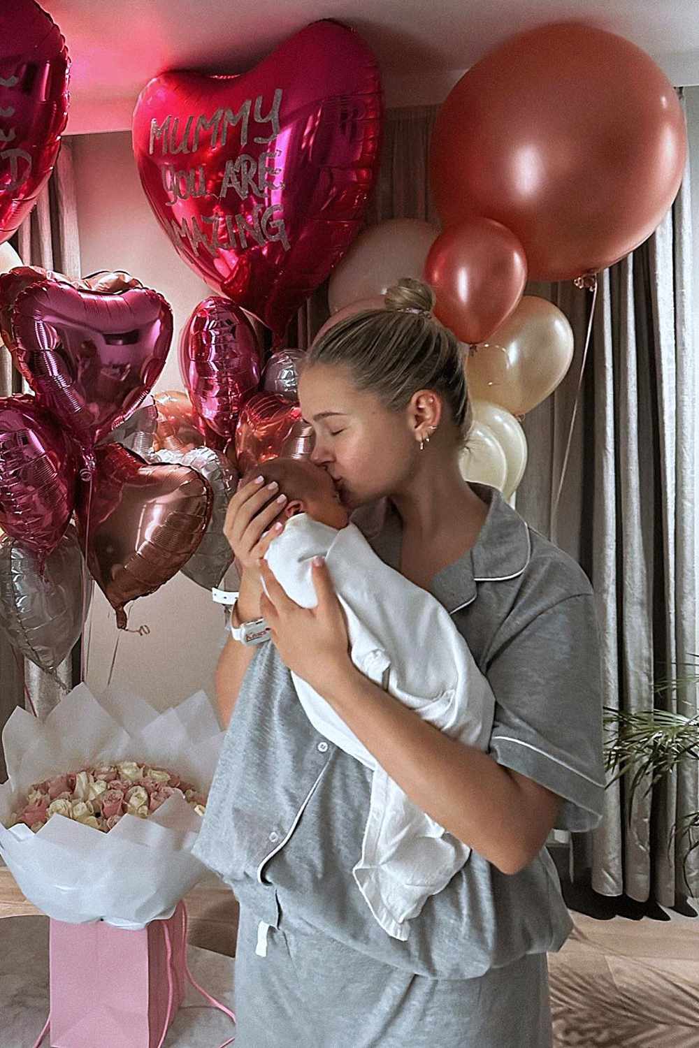 Molly-Mae Hague kisses her daughter Bambi in 2023.