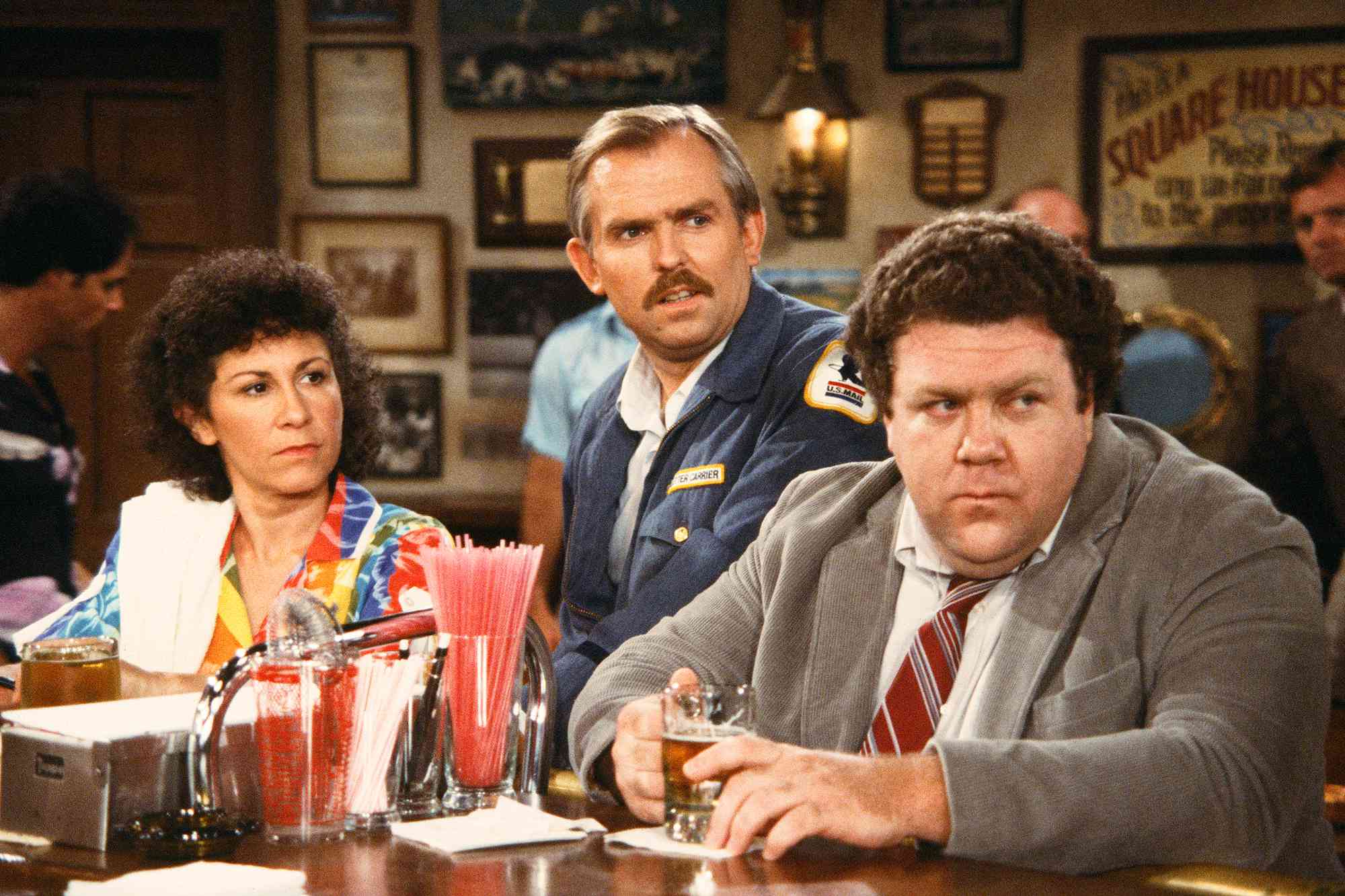 CHEERS - Rhea Perlman as Carla Tortelli, John Ratzenberger as Cliff Clavin, George Wendt as Norm Peterson 